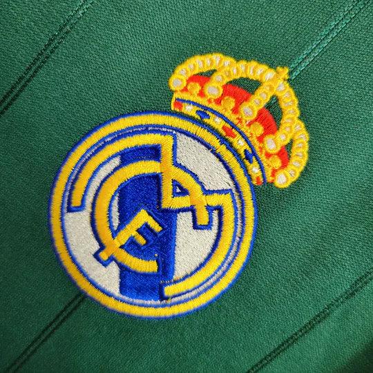 Maillot rétro du Real Madrid 2012-2013, marque Le 12 -ème Maillot, vue de face, avec logo et détails du maillot blanc.