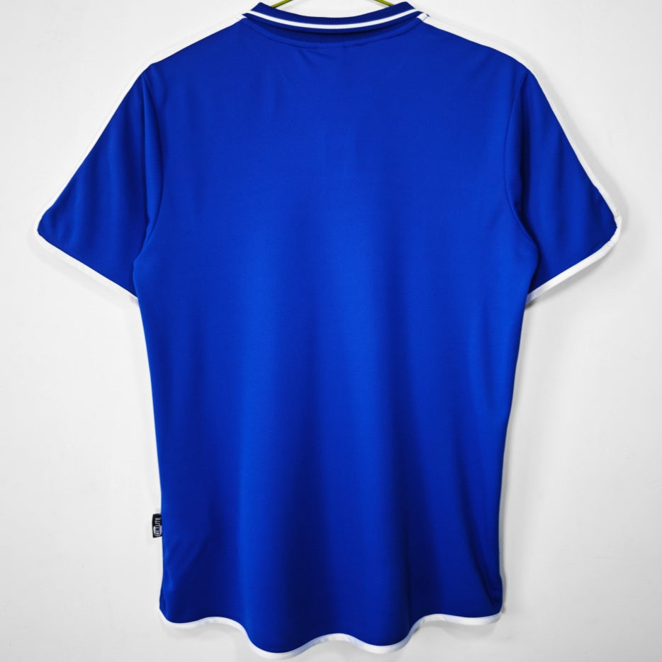 Maillot rétro domicile de l'équipe de France 2000, marque Le 12 -ème Maillot, vue de face avec logo et détails classiques.