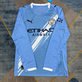 Maillot domicile Manchester City 25/26 manches longues, marque Le 12 -ème Maillot, vue de face avec logo et détails bleus