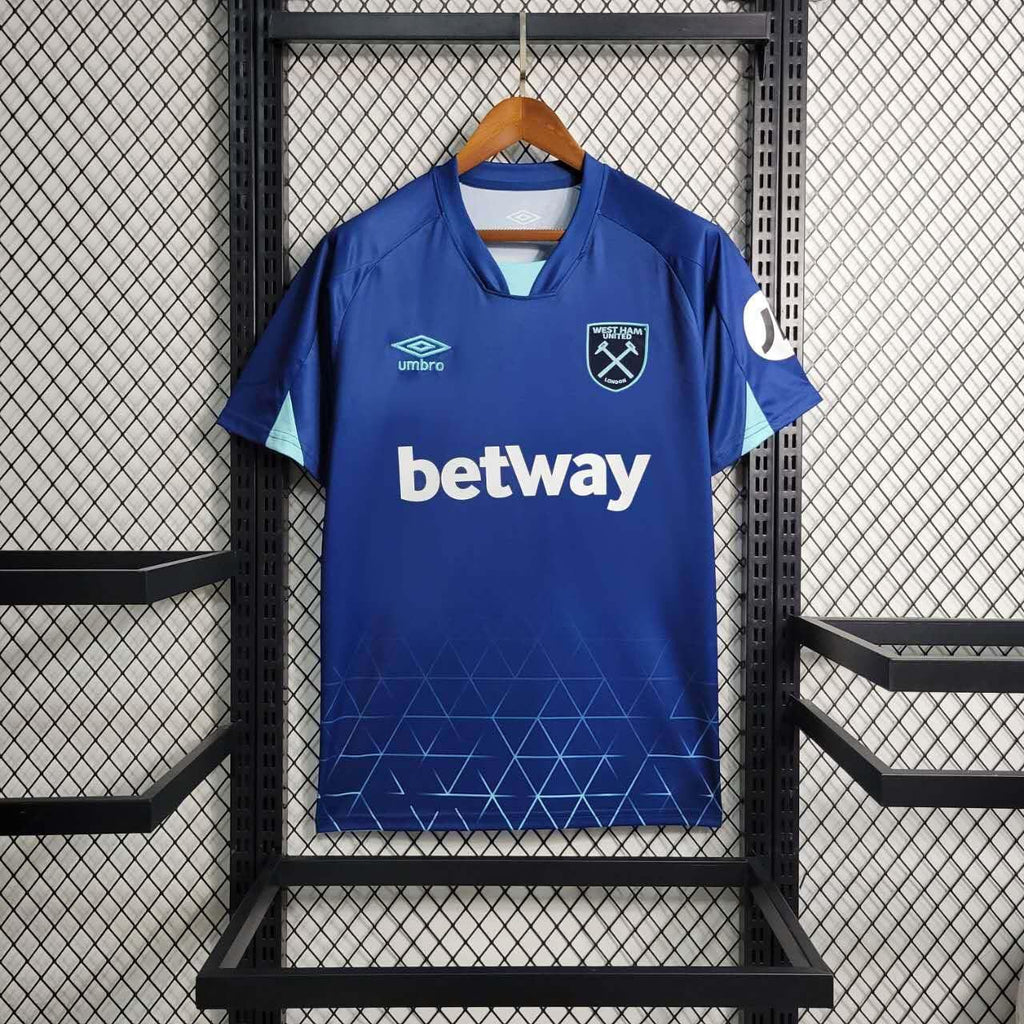 Maillot extérieur West Ham 2023-24 Le 12-ème Maillot, jersey de football bleu avec logo du club et détails de design.