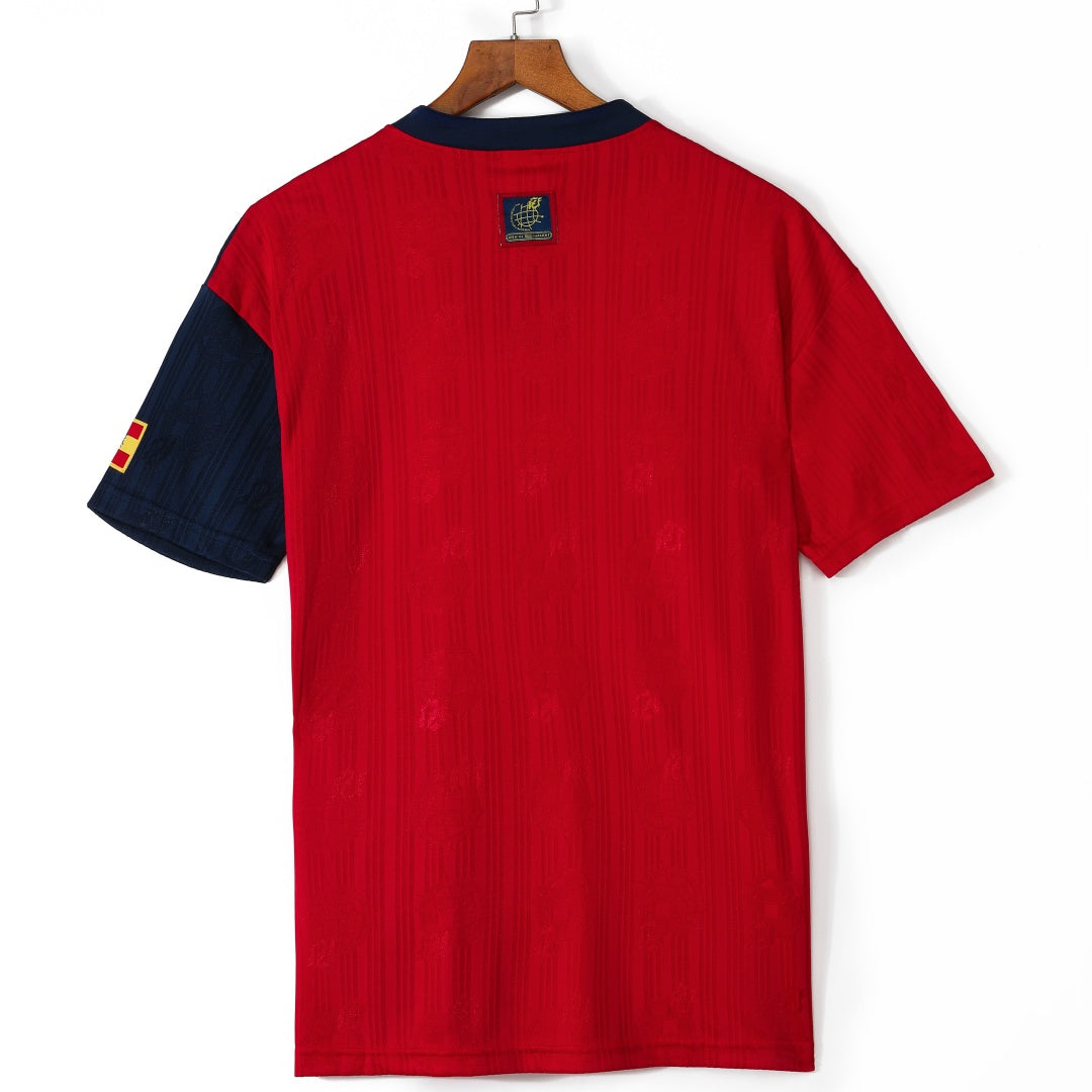 Maillot domicile rétro de l'équipe d'Espagne 1996, marque Le 12, avec logo et détails traditionnels sur le maillot.