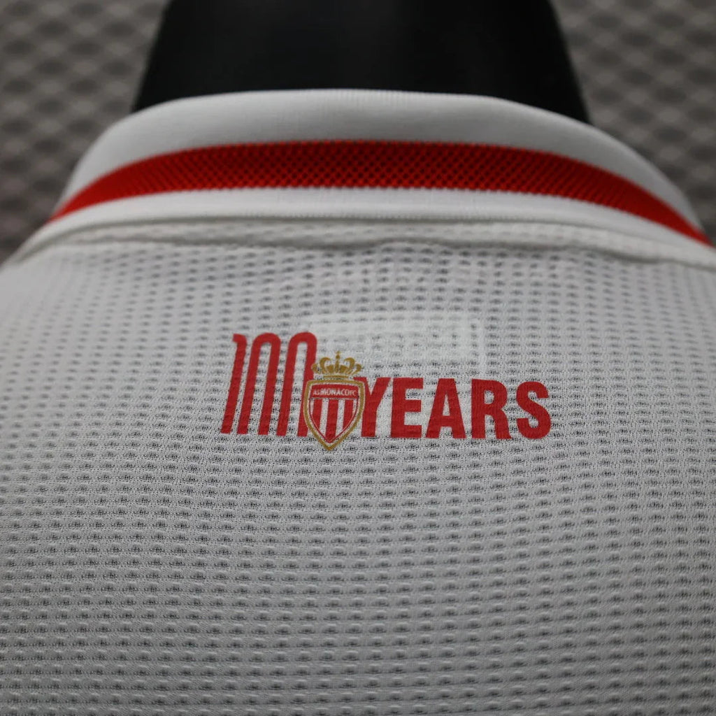 Maillot de football Monaco 2024-25 Le 12 -ème Maillot, logo et design du club visible sur le maillot.