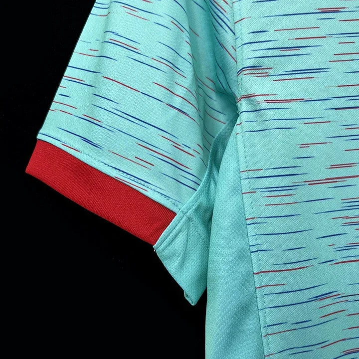 Maillot FC Barcelone saison 2023-2024 troisième, marque Le 12 -ème Maillot, vue du devant avec logo et design coloré.