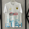 Maillot third AEK Athens 25/26 de la marque Le 12-ème, vue de face, avec logo et design coloré.