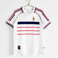 Maillot rétro de l'équipe de France 1998, marque Le 12 -ème Maillot, vue du maillot avec logo et détails colorés.