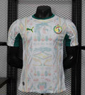 Maillot Sénégal Coupe du Monde 2026 Le 12 -ème Maillot, maillot de football jaune avec logo national et détails verts.