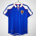 Maillot domicile rétro du Japon 2000, marque Le 12-ème Maillot, avec design classique et logo national visible.
