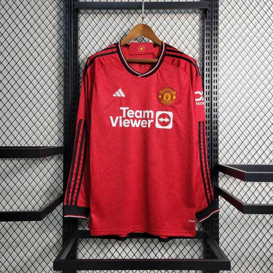 Maillot Manchester United 2023-2024 à manches longues, bleu avec logo du club, fabriqué par Le 12 -ème Maillot.