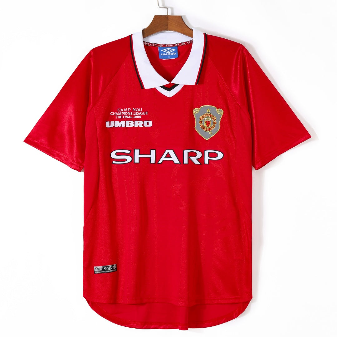 Maillot domicile rétro Manchester United 1999-2000 par Le 12, vue de face, avec logo et détails du maillot.