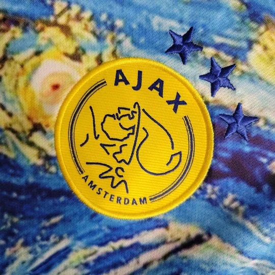 Maillot de football Ajax saison 2023-2024 édition spéciale de la marque Le 12, en couleurs vives et design unique.