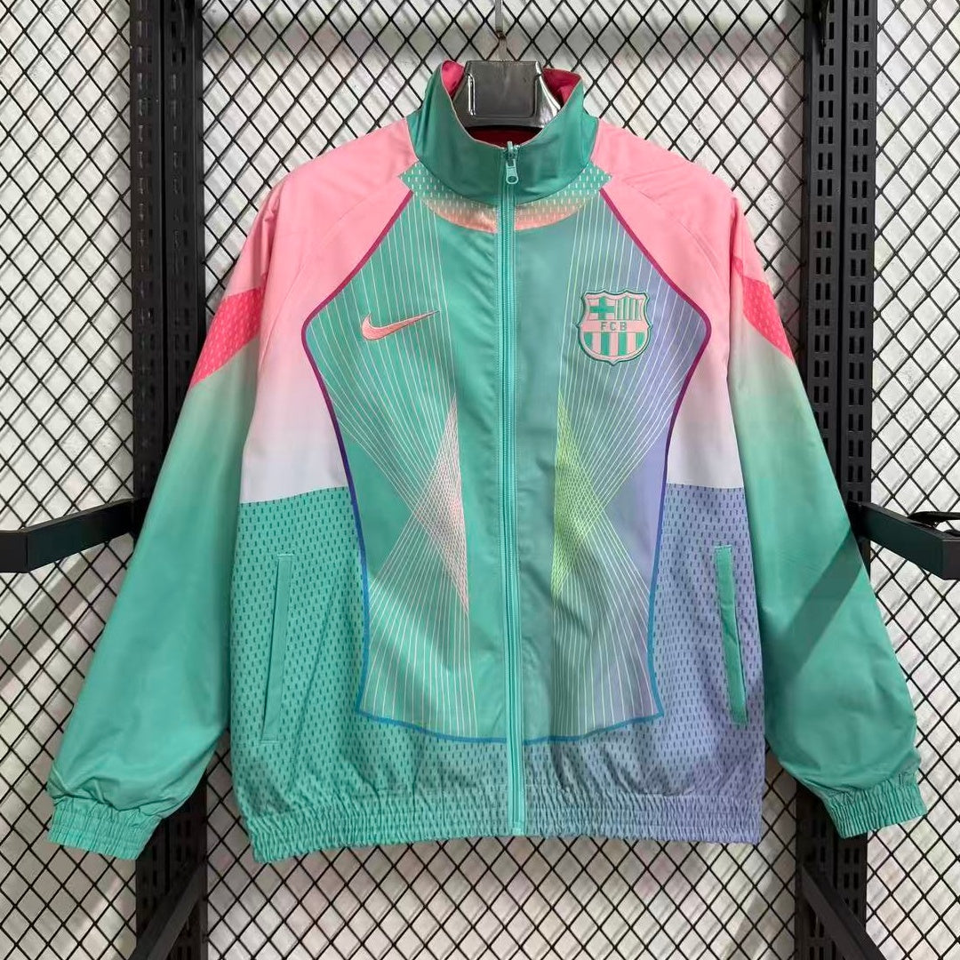Veste coupe-vent réversible Le 12 -ème Maillot Barcelone, légère et pratique, avec design coloré et fermeture éclair visible.