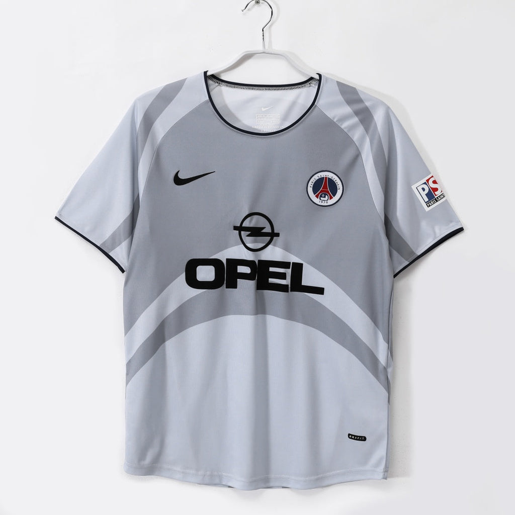 Maillot extérieur rétro PSG 2001-2002 Le 12-ème Maillot, maillot de football bleu avec logo et détails vintage.