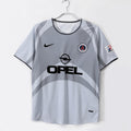 Maillot extérieur rétro PSG 2001-2002 Le 12-ème Maillot, maillot de football bleu avec logo et détails vintage.