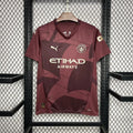 Maillot Manchester City 2024/25 Le 12 -ème Maillot, maillot de football bleu avec logo du club et détails de design.