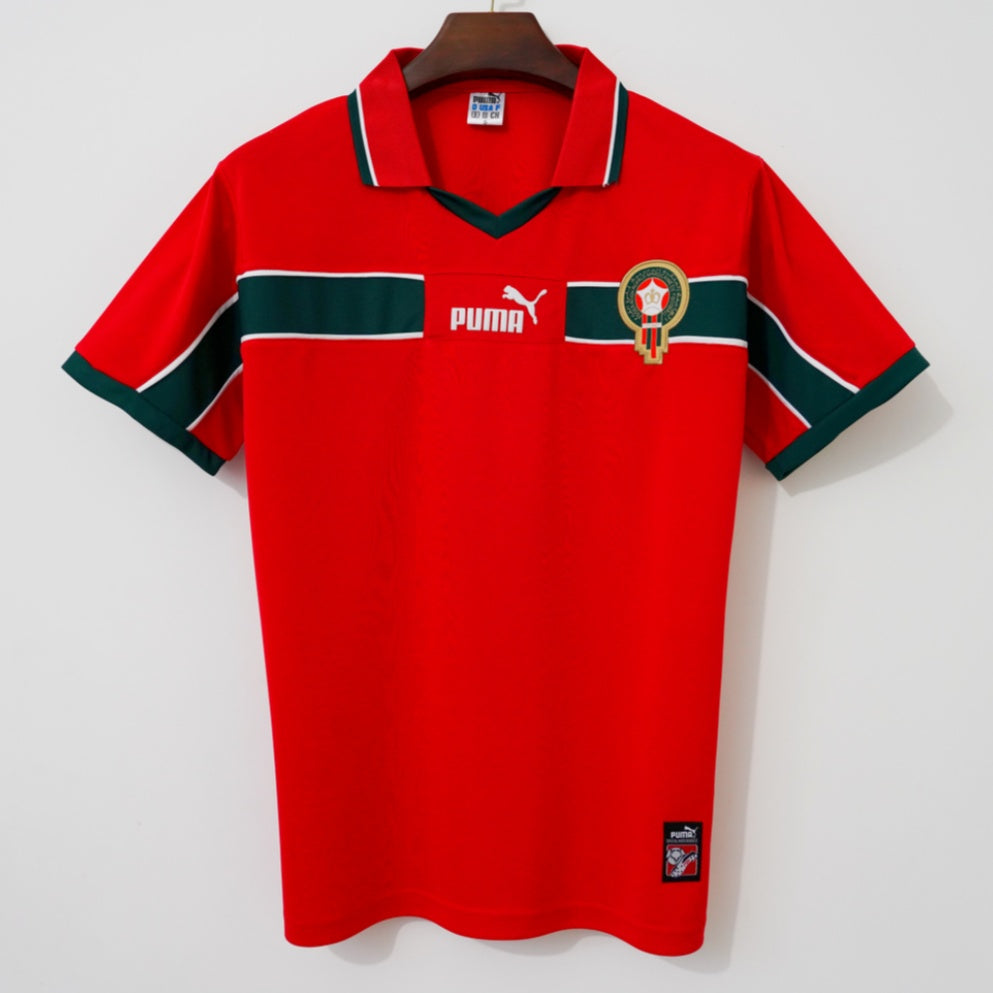 Maillot extérieur rétro 1998 Maroc de la marque Le 12, avec couleurs vives et logo du drapeau marocain.