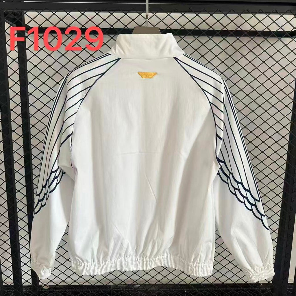Veste coupe-vent réversible PSG Le 12 -ème Maillot, légère, avec logo du Paris Saint-Germain visible sur la face extérieure.