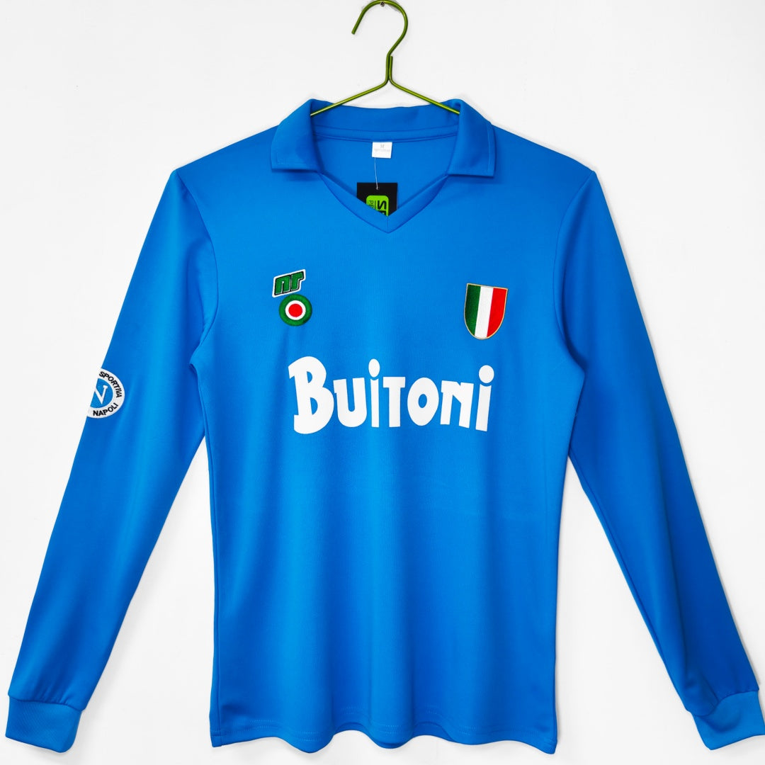 Maillot de football rétro Napoli 1987-1988 à manches longues, marque Le 12 -ème Maillot, détail des logos et couleurs historiques.