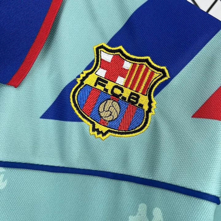 Maillot de football FC Barcelone rétro 1992-1995, marque Le 12, avec logo et design vintage visible sur l'image.