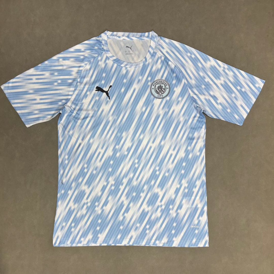 Maillot Manchester City 25/26 Le 12 -ème Maillot, maillot de football bleu pour enfants, détails du design et logo visible.