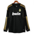 Maillot rétro extérieur Real Madrid 2011-2012 à manches longues, marque Le 12-ème Maillot, design vintage et sportif.