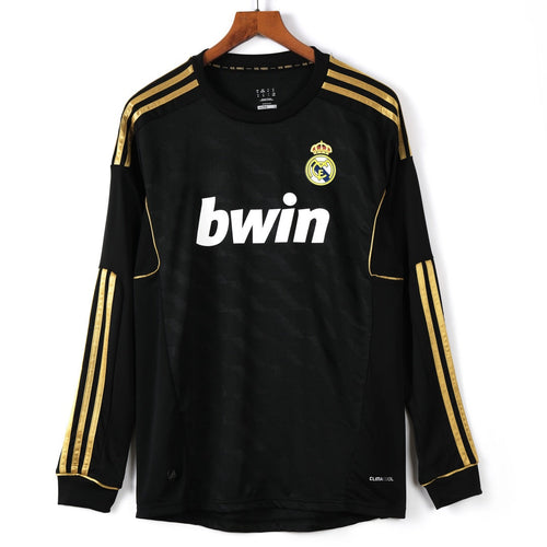 Maillot rétro extérieur Real Madrid 2011-2012 à manches longues, marque Le 12-ème Maillot, design vintage et sportif.