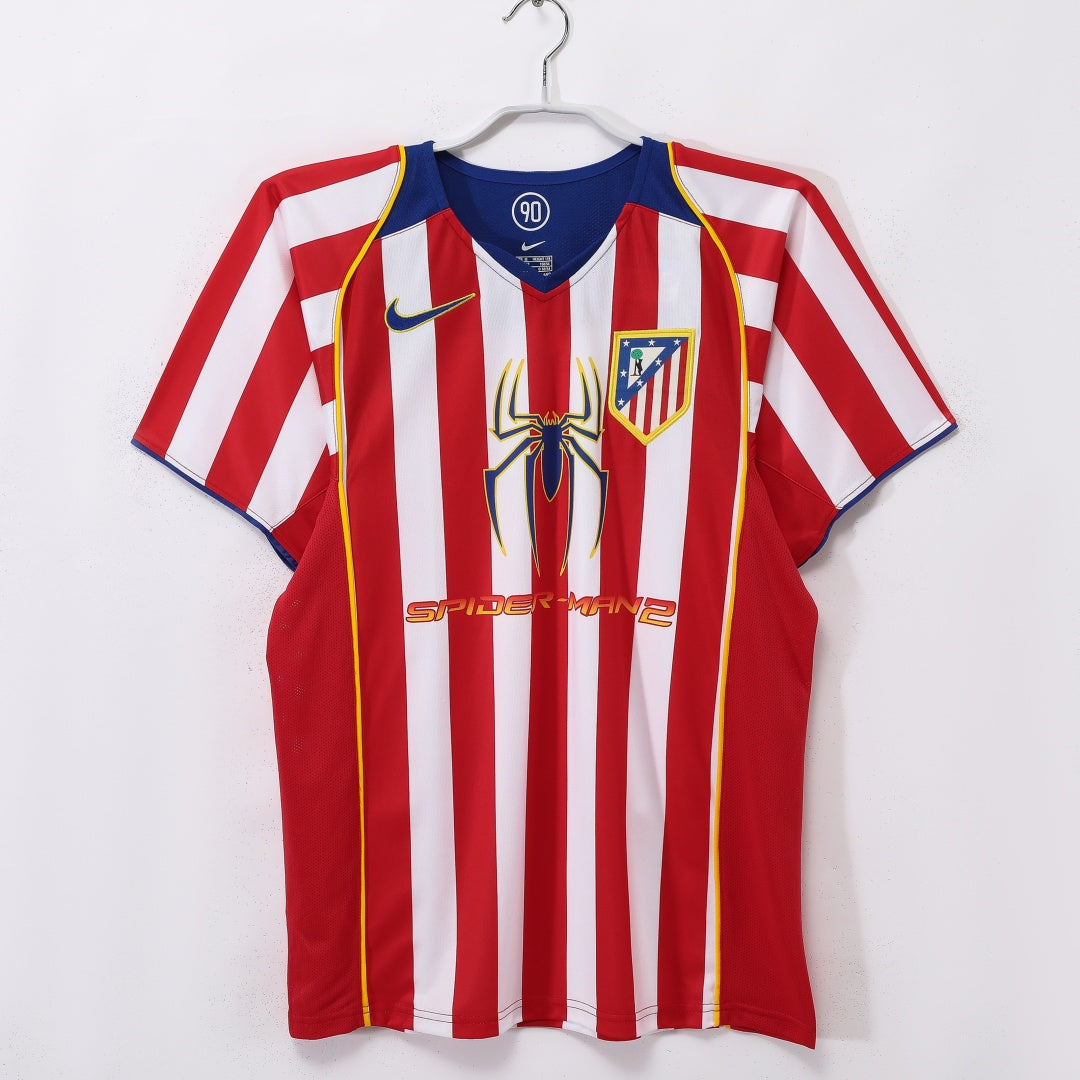 Maillot domicile rétro de l'Atlético Madrid 2004-2005, marque Le 12 -ème Maillot, vue de face avec logo et détails du maillot.