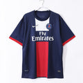 Maillot domicile rétro du PSG 2013-2014, marque Le 12 -ème Maillot, avec logo du club et design classique.