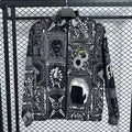 Veste coupe-vent réversible Arsenal Le 12 -ème Maillot, couleur noire et rouge, avec logo de l'équipe sur le devant.