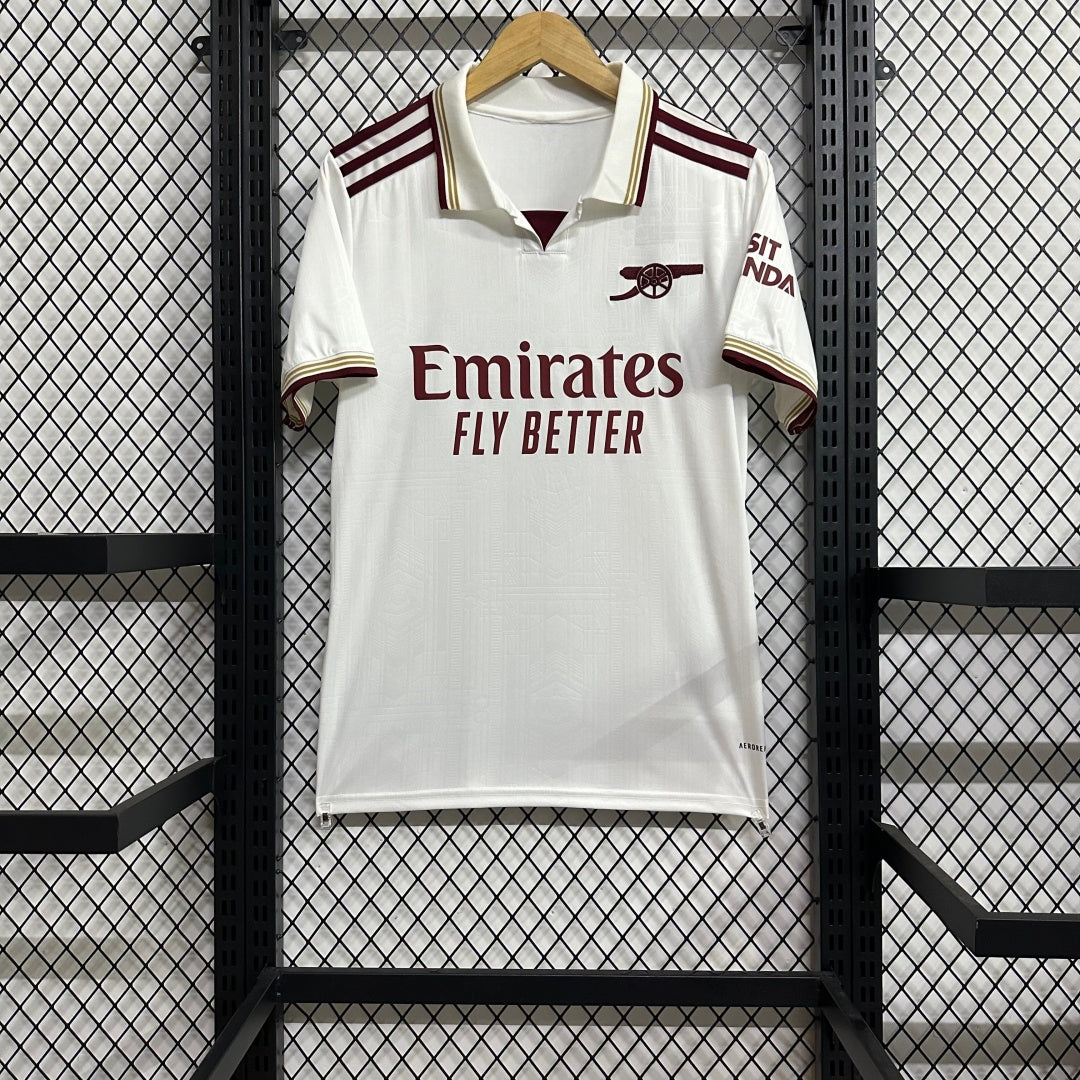 Maillot third Arsenal 25/26 de Le 12 -ème Maillot, maillot de football avec logo et design orange et noir.
