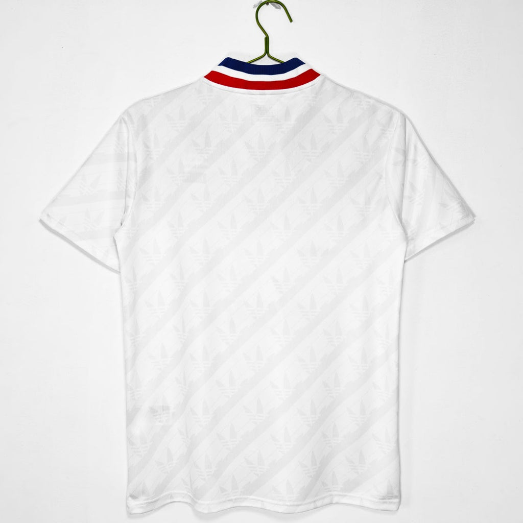 Maillot domicile rétro de Lyon 1995-1996, marque Le 12 -ème Maillot, vue de face, bleu avec détails blancs, style vintage.
