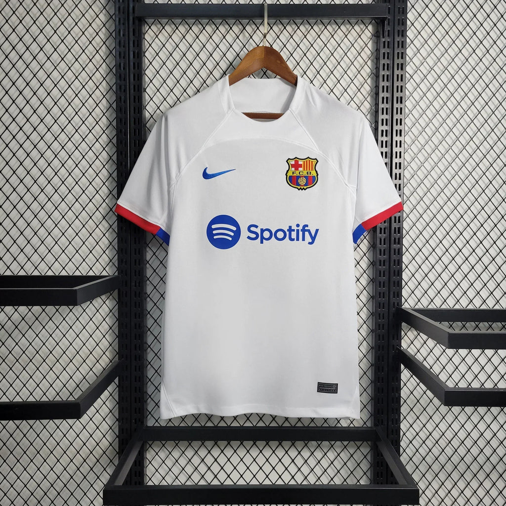 Maillot extérieur FC Barcelone 2023-2024 Le 12 -ème Maillot, maillot de football avec logo et détails colorés.