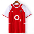 Maillot domicile rétro de l'Arsenal 2002-2004, signé Le 12 -ème Maillot, avec logo et couleurs traditionnelles du club.