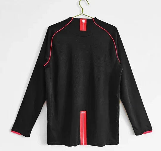 Maillot extérieur Manchester United 07-08 à manches longues, version de Le 12 -ème Maillot, vue de face avec logo.