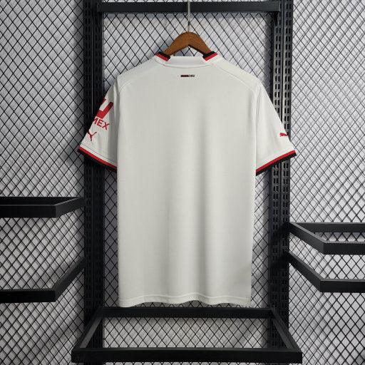 Maillot extérieur AC Milan 2022/23 de la marque Le 12 -ème Maillot, vue de face avec logo et détails du design.
