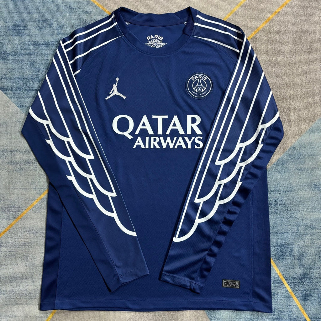 Maillot PSG 25/26 à manches longues, modèle third, en bleu avec logo Le 12 -ème Maillot, vue de face.