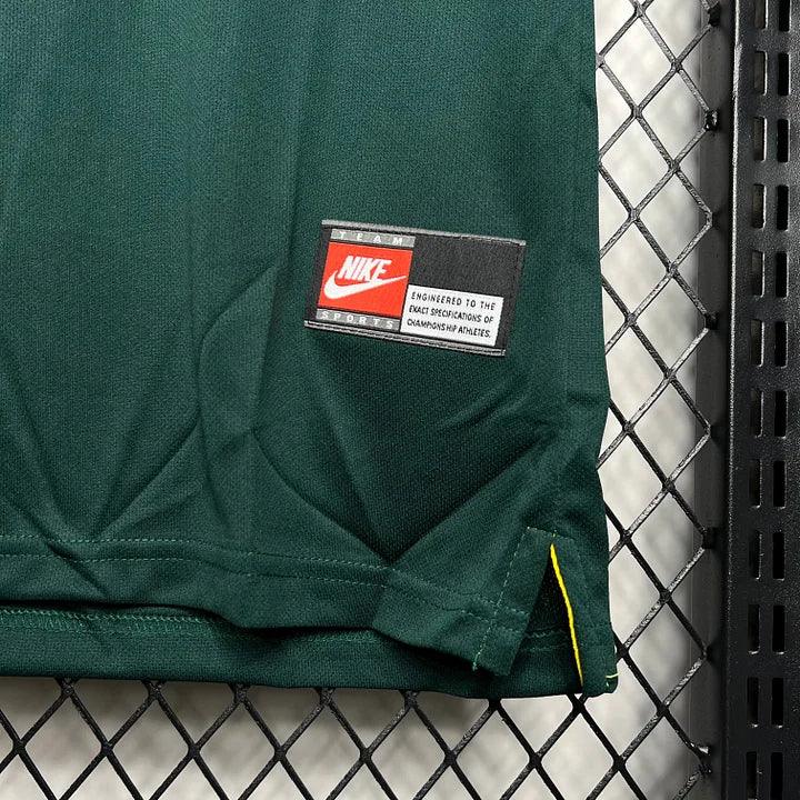 Maillot de football Brésil 1998 Le 12 -ème Maillot, dos et logo, en tissu sportif bleu et jaune avec détails rétro.