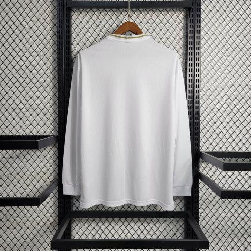 Maillot long manches Real Madrid 2019-2020 rétro, marque Le 12-ème Maillot, vue de face avec logo et détails du maillot.