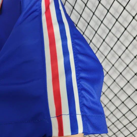 Maillot rétro de l'équipe de France 1994 de la marque Le 12, vue de face avec détails du design vintage.