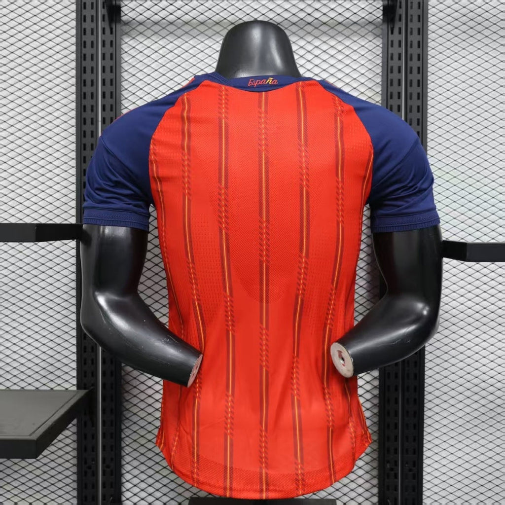 Maillot domicile Espagne 25/26 de Le 12 -ème Maillot, vue de face avec logo et détails du maillot rouge et bleu.