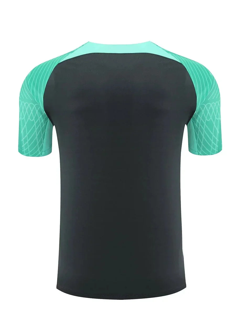 Maillot d'entraînement FC Barcelone 2023-2024 Le 12, maillot de sport bleu avec logo du club et détails de l'équipe.