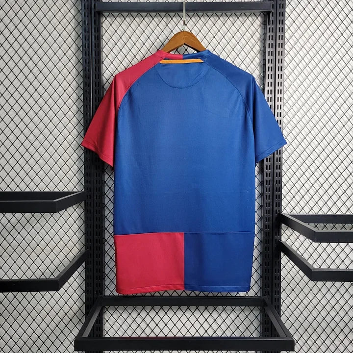 Maillot rétro FC Barcelone saison 2008-2009 Le 12, maillot de football bleu et grenat avec logo du club.