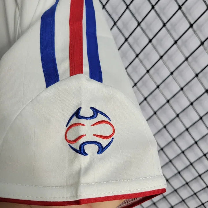 Maillot rétro de l'équipe de France 2006, modèle Le 12 -ème Maillot, avec le logo et les couleurs traditionnelles françaises.
