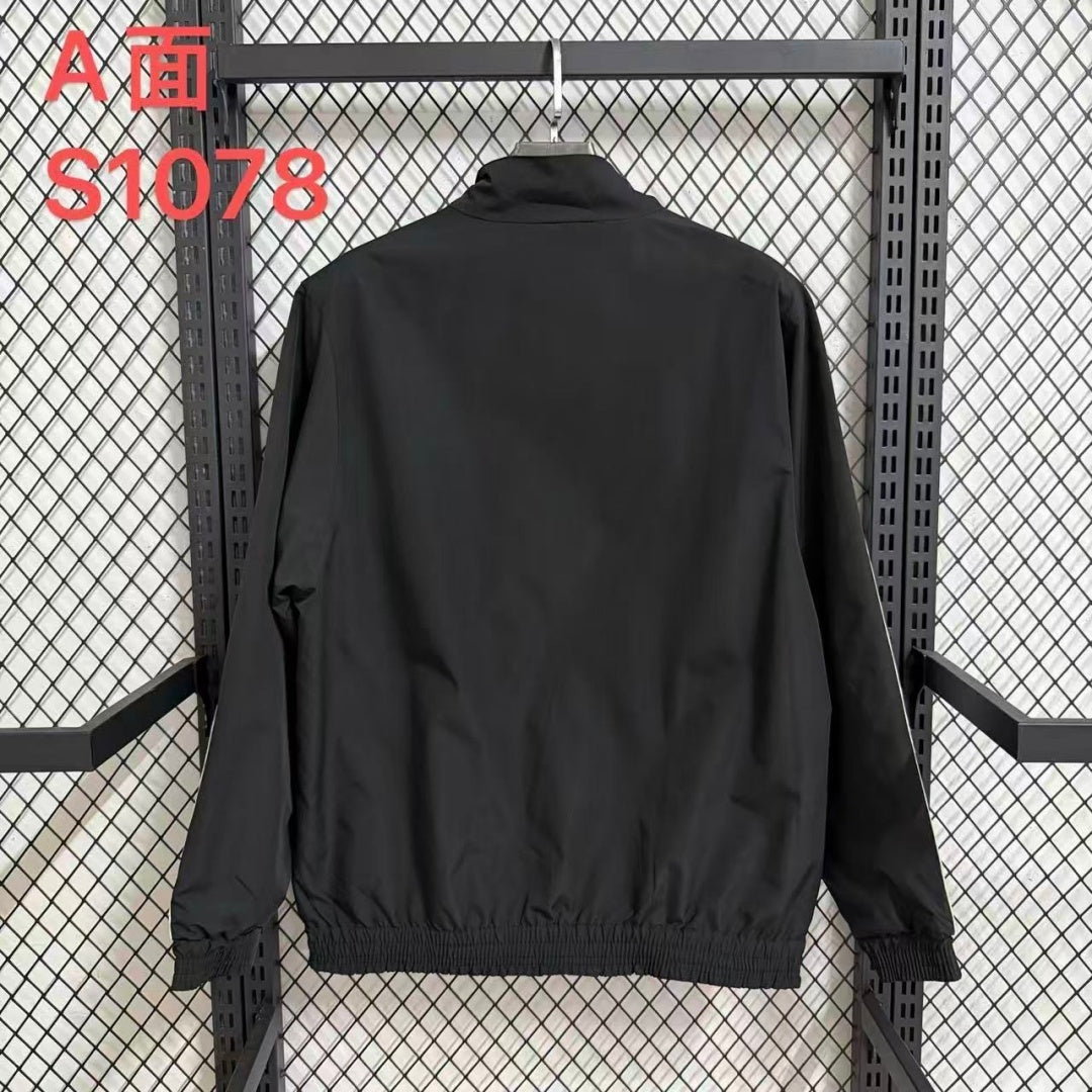 Veste coupe-vent réversible Le 12 -ème Maillot Allemagne, vue de face, détails des matériaux et design moderne.