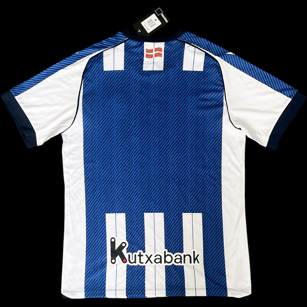 Maillot domicile Real Sociedad 25/26 de Le 12 –ème Maillot, maillot de football bleu avec logo et détails officiels.