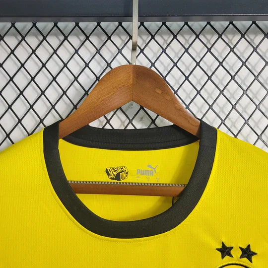 Maillot Dortmund 2023 2024 à manches longues, version officielle de la saison, avec le logo du club et design bleu et jaune.