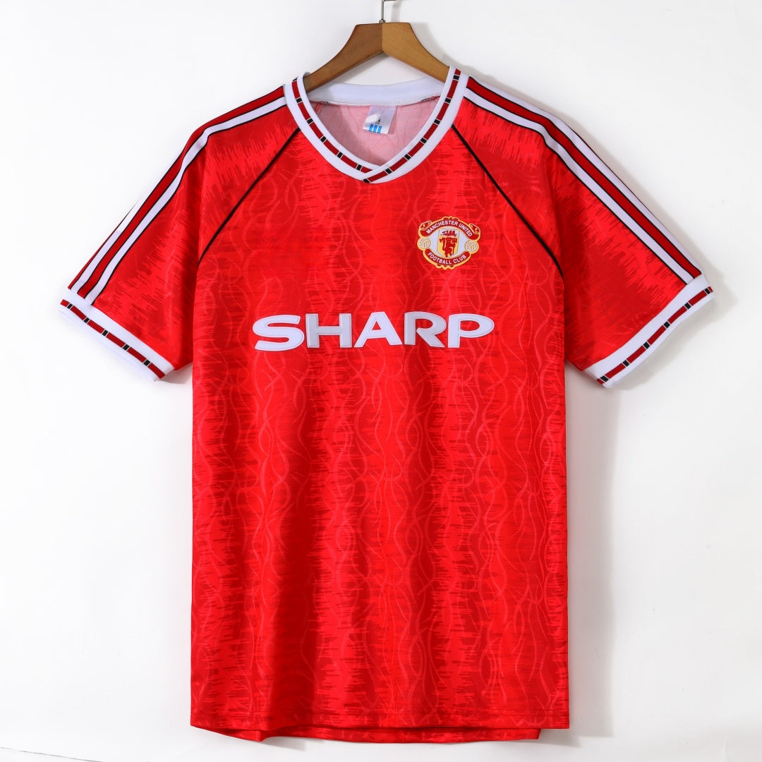 Maillot domicile rétro Manchester United 1991-1992, marque Le 12, en tissu rouge avec détails blancs, vue de face.