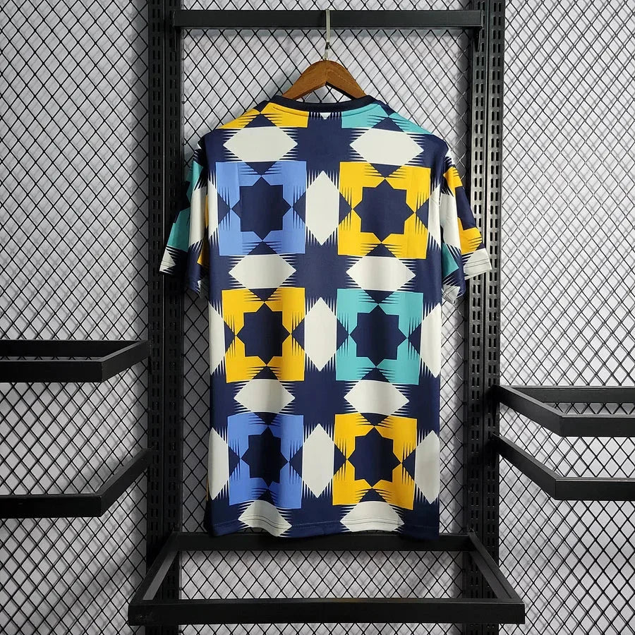 Maillot d'entraînement de l'Algérie 2022-2023, marque Le 12 -ème Maillot, vue front avec logo et détails en bleu et vert