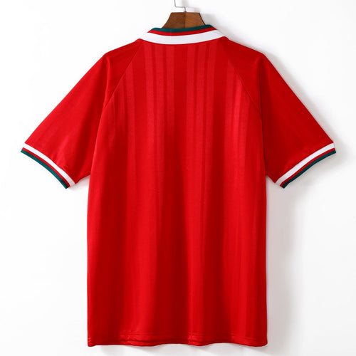 Maillot domicile rétro Liverpool 1993-1995 Le 12, maillot de football avec logo et design vintage visible sur l'image.