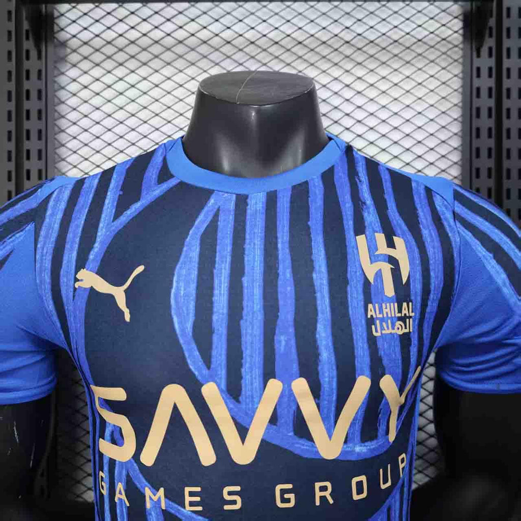 Maillot de football Al Hilal 2025-26, marque Le 12-ème Maillot, vue front avec logo et design sportif visible.