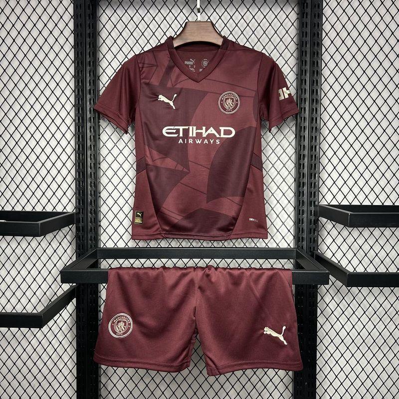 Maillot enfant Manchester City 2024-25 de Le 12 -ème Maillot, kit de football avec logo et couleurs officielles.